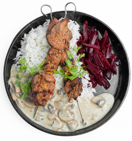 Grilled pork skewers with beets and mushroom sauce