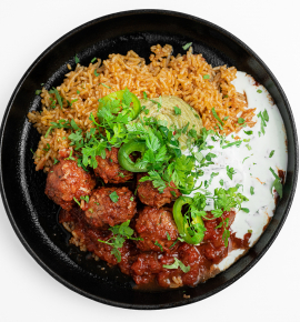 Pork meatballs with Mexican rice, tomato salsa sauce and guacamole